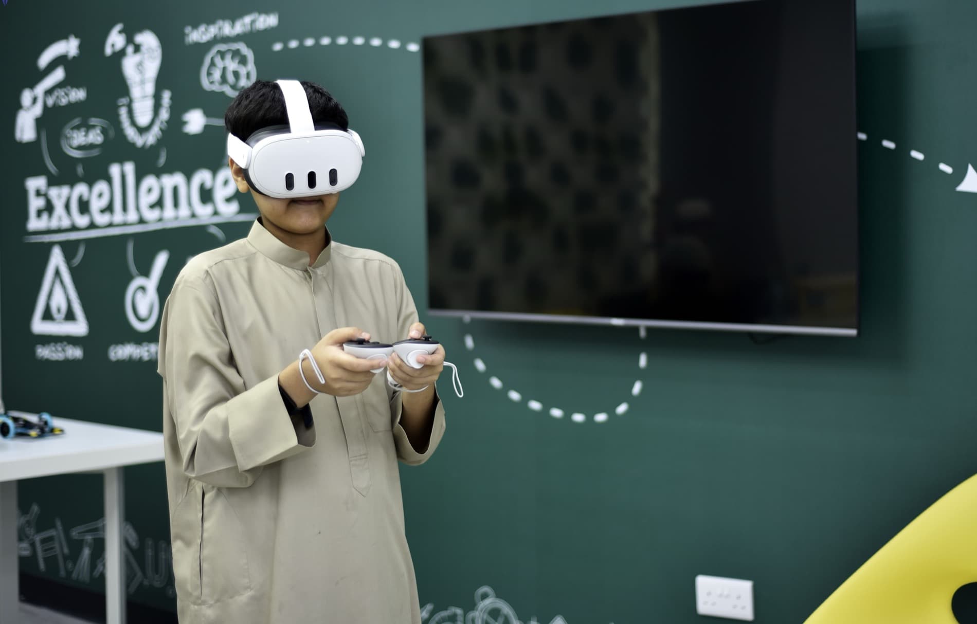 A Young Leaders Hub student using a VR headset in class